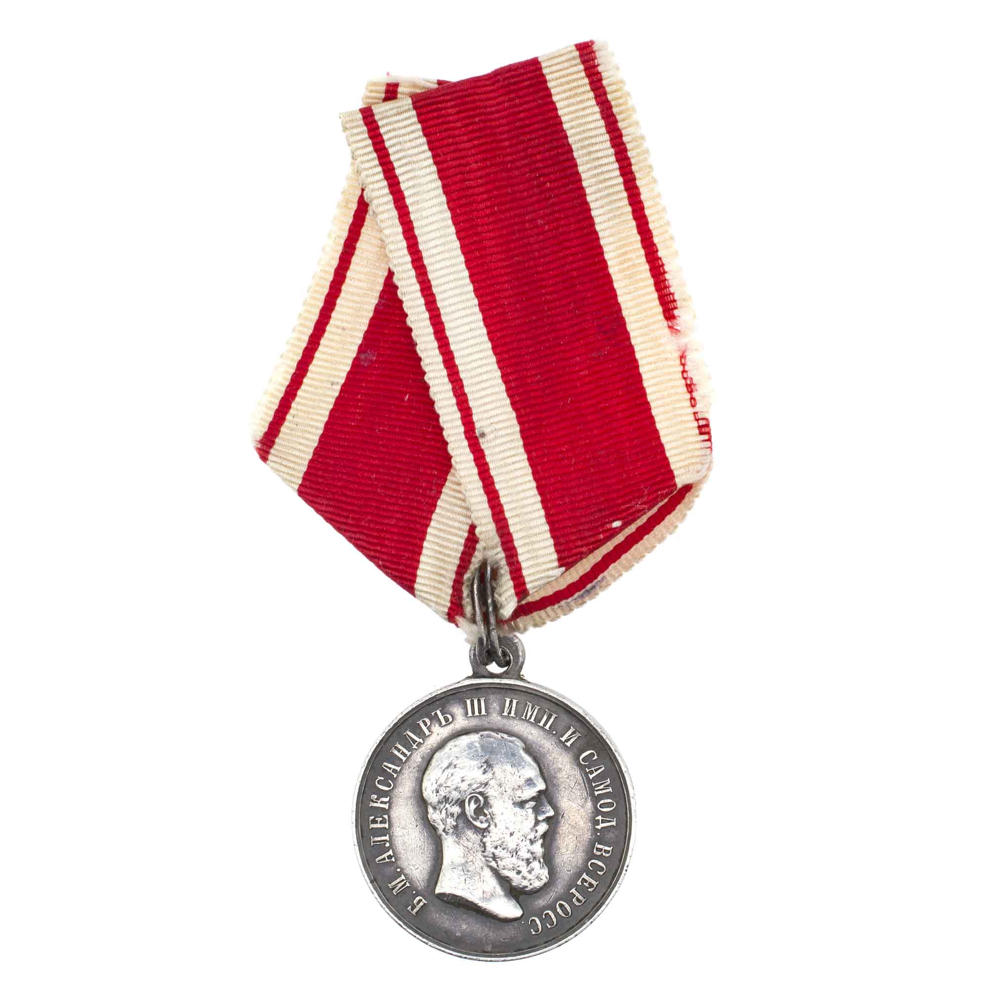 Медаль "За Усердие" с портретом Императора Александра III на ленте ордена Св. Станислава. Нагрудная, 1884 - 1888 гг. Серебро.
