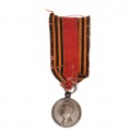 Медаль "За покорение Западного Кавказа", на соединенной ленте орденов Св. Георгия и Св. Александра Невского , сложенной в виде колодки.
