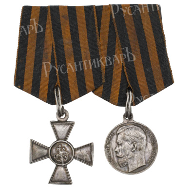 Наградная колодка на две награды Георгиевский Крест 4 ст 193.579 и Георгиевская Медаль ("За Храбрость") 4 ст № 280.107. (8 Сибирский стрелковый полк)